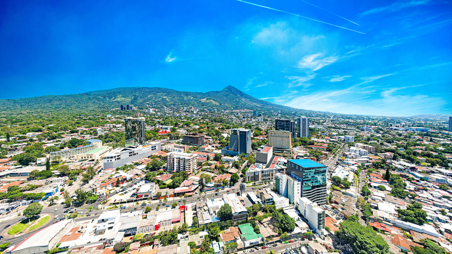 Aerial view of San Benito and Zona Rosa with San Salvador volcano in the background