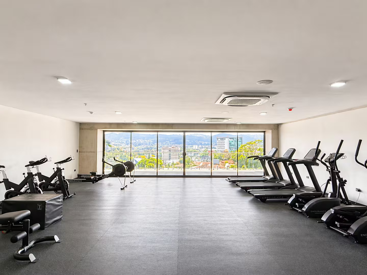 Fitness center with city views at Art Haus Tower